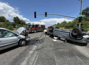 Accident Scene involving Truck Rollover and 2 other Vehicles